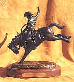 One Buck Left Til Payday - bronze by sculptor Susan Lynes
